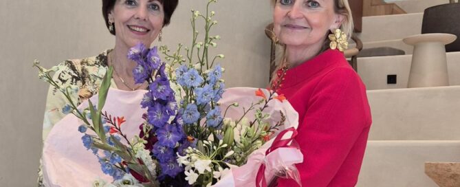 NBCC CEO Lyne Biewinga handing flowers to Janet Poot